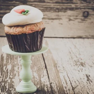 Cupcake on stand with rustic background Stock Photos