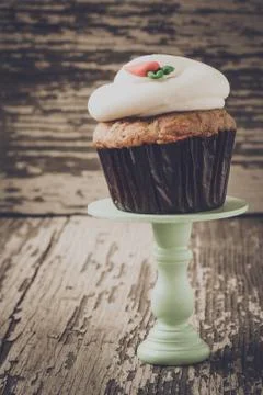 Cupcake on stand with rustic background Stock Photos