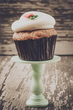Cupcake on stand with rustic background Stock Photos