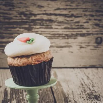 Cupcake on stand with rustic background Stock Photos