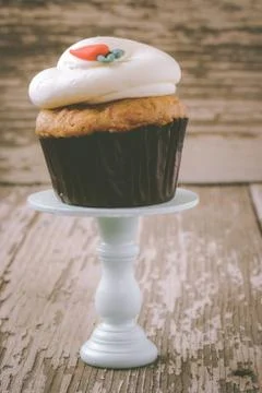 Cupcake on stand with rustic background Stock Photos