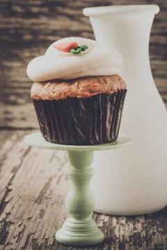 Cupcake on stand with rustic background Stock Photos