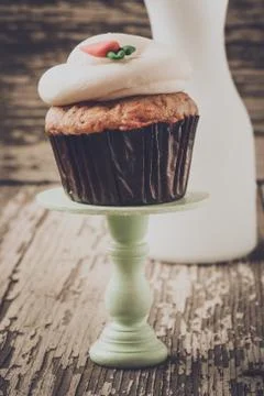 Cupcake on stand with rustic background Stock Photos