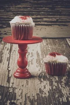 Cupcake on stand with rustic background Stock Photos