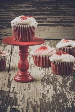 Cupcake on stand with rustic background Stock Photos