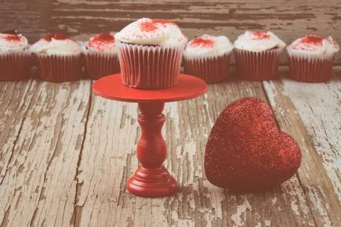 Cupcake on stand with rustic background Stock Photos