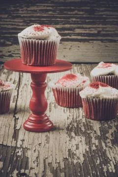 Cupcake on stand with rustic background Stock Photos