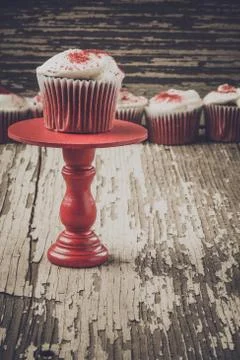 Cupcake on stand with rustic background Stock Photos