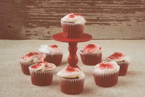 Cupcake on stand with rustic background Stock Photos