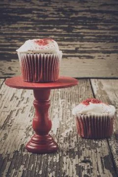Cupcake on stand with rustic backrgound Stock Photos