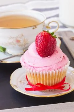Cupcake with strawberry Stock Photos
