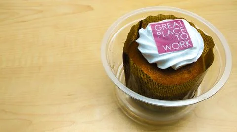 Cupcake on table, great place to work Stock Photos
