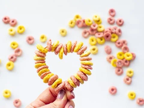 Cupcake toppers made with froot ring shaped cereal for Valentine's Day Stock Photos