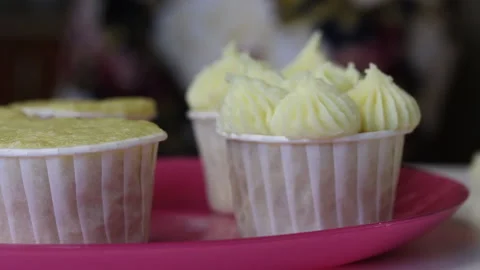 Cupcake tray. With and without cream. Close-up shot. In the background there  Stock Footage 140609047