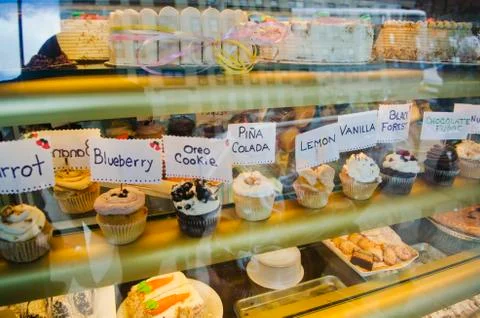 Cupcakes in bakery window Stock Photos