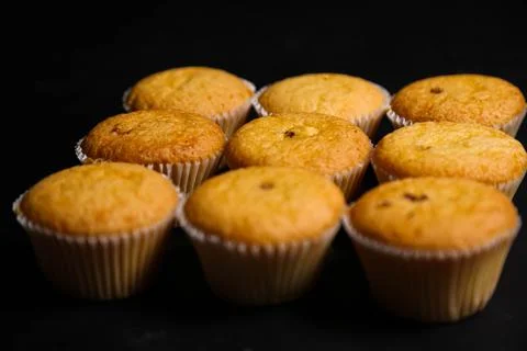 Cupcakes on a black background. Baking 写真素材