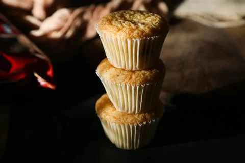 Cupcakes on a black background. Baking Stock Photos