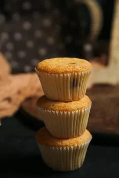 Cupcakes on a black background. Baking Stock Photos