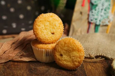 Cupcakes on a black background. Baking Stock Photos
