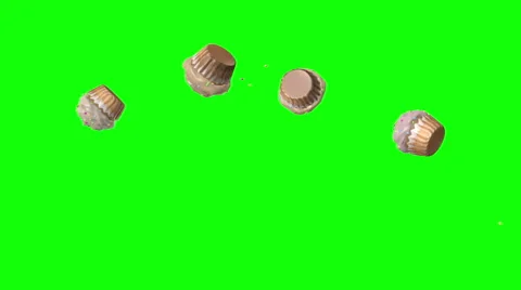 Cupcakes bouncing on green screen chroma key background. Stock Footage 58767424