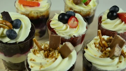 Cupcakes with cream spin on table Stock Footage 120401475