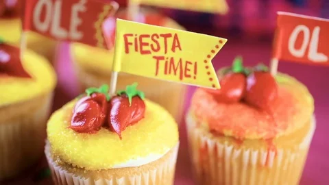 Cupcakes decorated with red chili peppers for Cinco de Mayo. Stock Footage