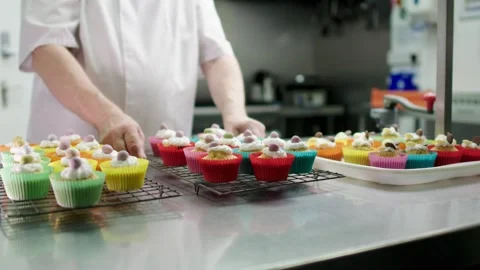Cupcakes made in kitchen by chef Stock Footage 247456411