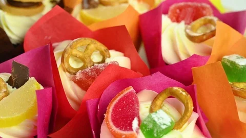 Cupcakes in multi-colored packages spin Stock Footage 120401701