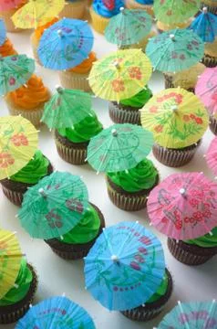 Cupcakes with umbrellas Stock Photos
