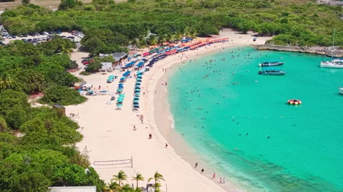 Cupecoy, St. Maarten, Drone Shot of Mullet Bay Beach, People and Parasols on Video stock 339698916