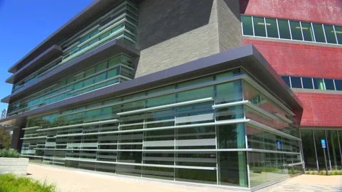 CUPERTINO, CA - 2023 - Establishing panning shot of the exterior of a generic Stock Footage 264612092