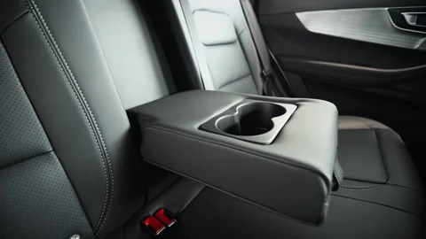 Cupholders in the armrest. Command Central, The Intersection of Luxury and Stock Footage 257762548
