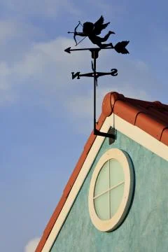 Cupid on weathervane Stock Photos