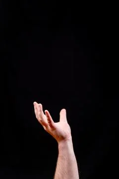 Cupped Hand Holding a Void on a Black Background Stock Photos