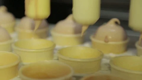Cups are filled with ice cream, ice-cream freezing Stock Footage 74505565