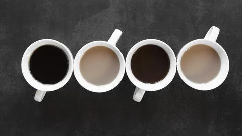 Cups of coffee on table Stock Photos