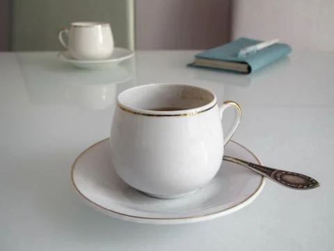 Cups of espresso and notebook Stock Photos