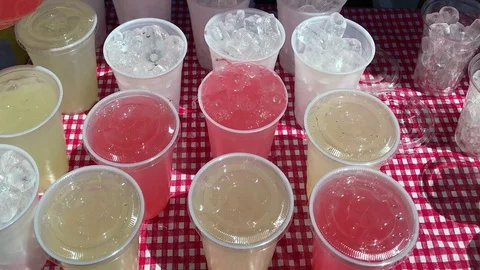 Cups of Ice Filled With Pink Lemonade Stock Footage 76140822