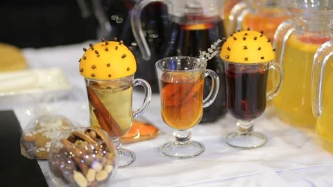 Cups of mulled wine with slice of orange and cinnamon. Christmas mood Stock Footage 99701689
