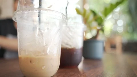Cups of plastic ice milk coffee drinks Video stock 121091878