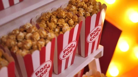 Cups of popcorn on a wooden stand Stock Footage 277470073