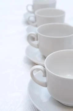 Cups on saucers Stock Photos