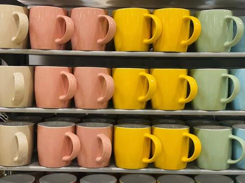 Cups on a shelf Stock Photos