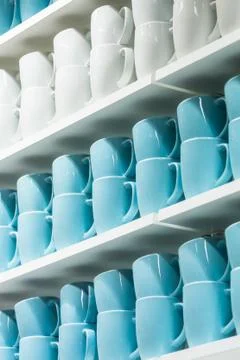 Cups on the shelves Stock Photos