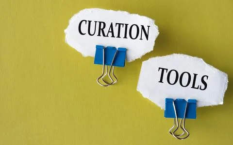 CURATION TOOLS - the words is printed on a white piece of paper on a yellow.. Stock Photos