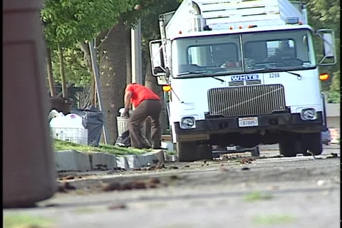 CURBSIDE GARBAGE COLLECTION Stock Footage 1052535