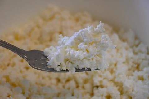 Curd cheese on a spoon 스톡 사진