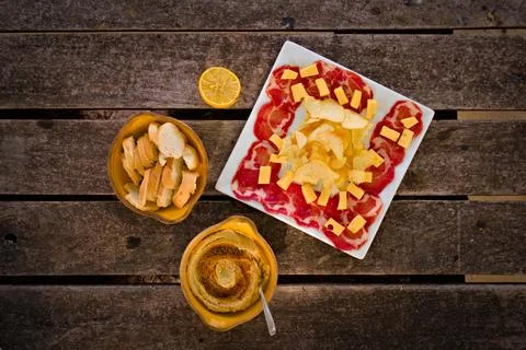Cured ham, cheese, bread and hummus. Traditional mediterranean appetizer. Top Stock Photos
