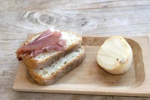 Cured Ham Slice on Bread rustic snack Stock Photos