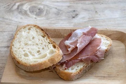 Cured Ham Slice on Bread rustic snack Stock Photos